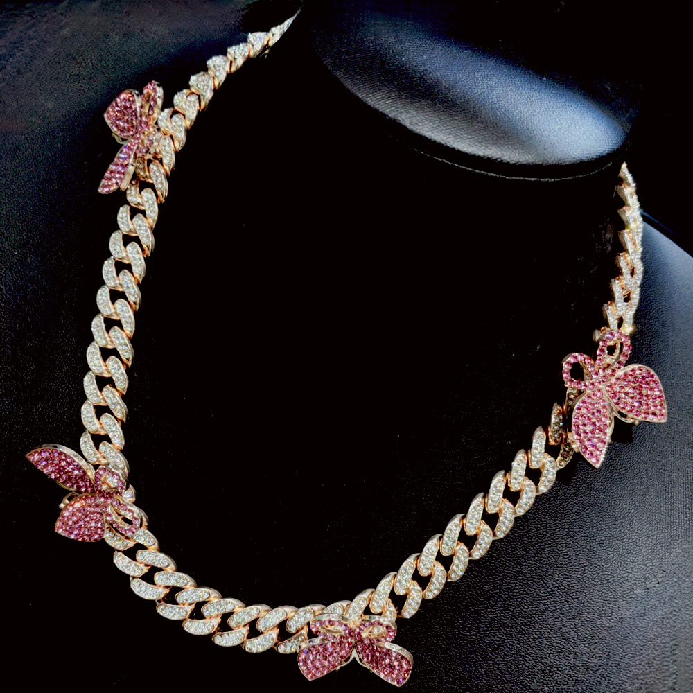 NORVIA pink butterfly Cuban chain jewelry worn