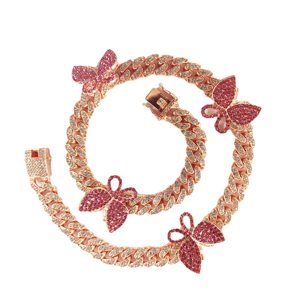 NORVIA pink butterfly Cuban chain jewelry worn