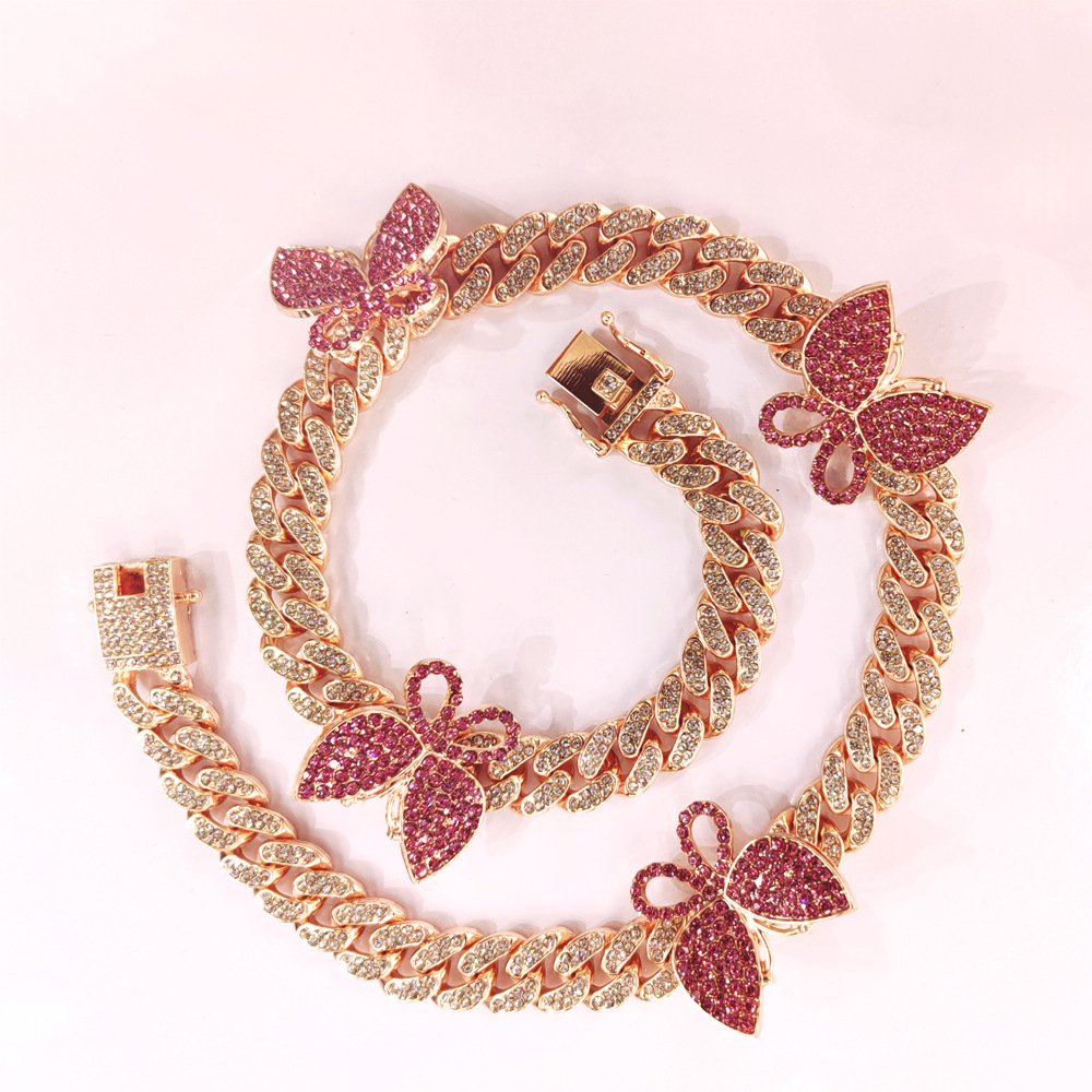 NORVIA pink butterfly Cuban chain jewelry worn