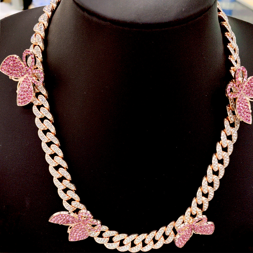 NORVIA pink butterfly Cuban chain jewelry worn